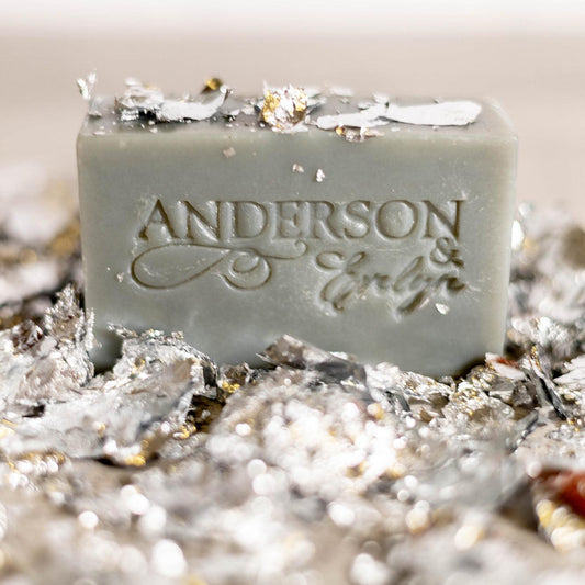 Natural soap bar with metallic flakes, engraved lettering, antimicrobial skincare product