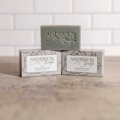 All-natural silver ion soap bar and boxes on counter, minimalist bath setting